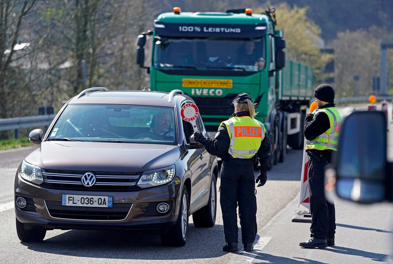 German Federal police officers control vehicles at the closed border to France due to the Coronovirus Pandemic