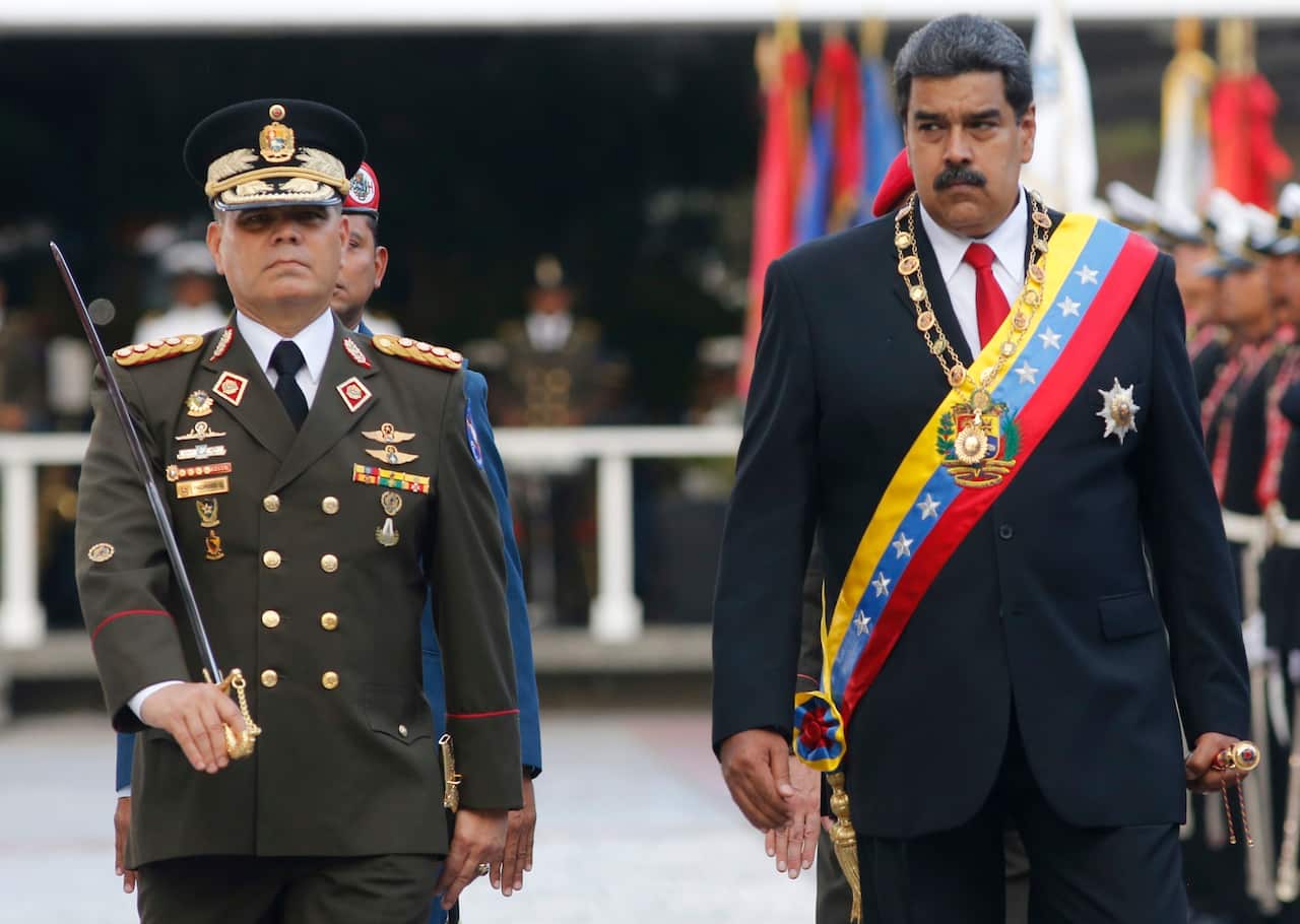The US has accused Mr Maduro (right) of being the leader of a cocaine trafficking group called "The Cartel of the Suns."