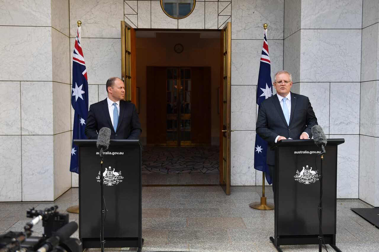 Treasurer Josh Frydenberg and Prime Minister Scott Morrison announce the government's $130b wage subsidy package at a press conference at Parliament House in Canberra, Monday, March 30, 2020. (AAP Image/Mick Tsikas) NO ARCHIVING
