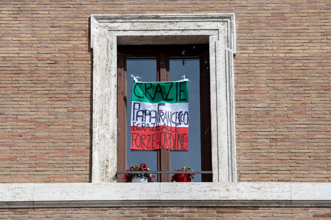 An Italian flag with the inscription: 'Thank you Pope Francis and thank you to to law enforcement' hung during the lockdown.