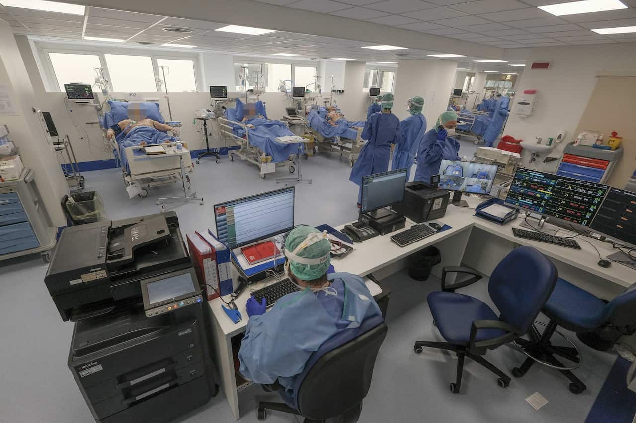 Medical personell and patients at a newly set up intensive care unit for the treatment of Coronavirus Covid-19 in a hospital in Brescia, Italy.
