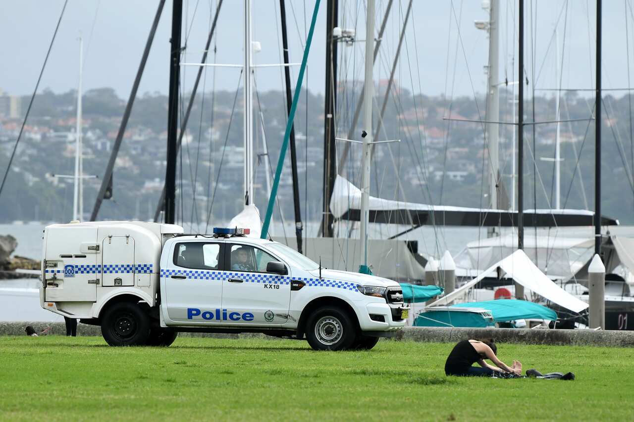 NSW Police officers monitor people in parks.