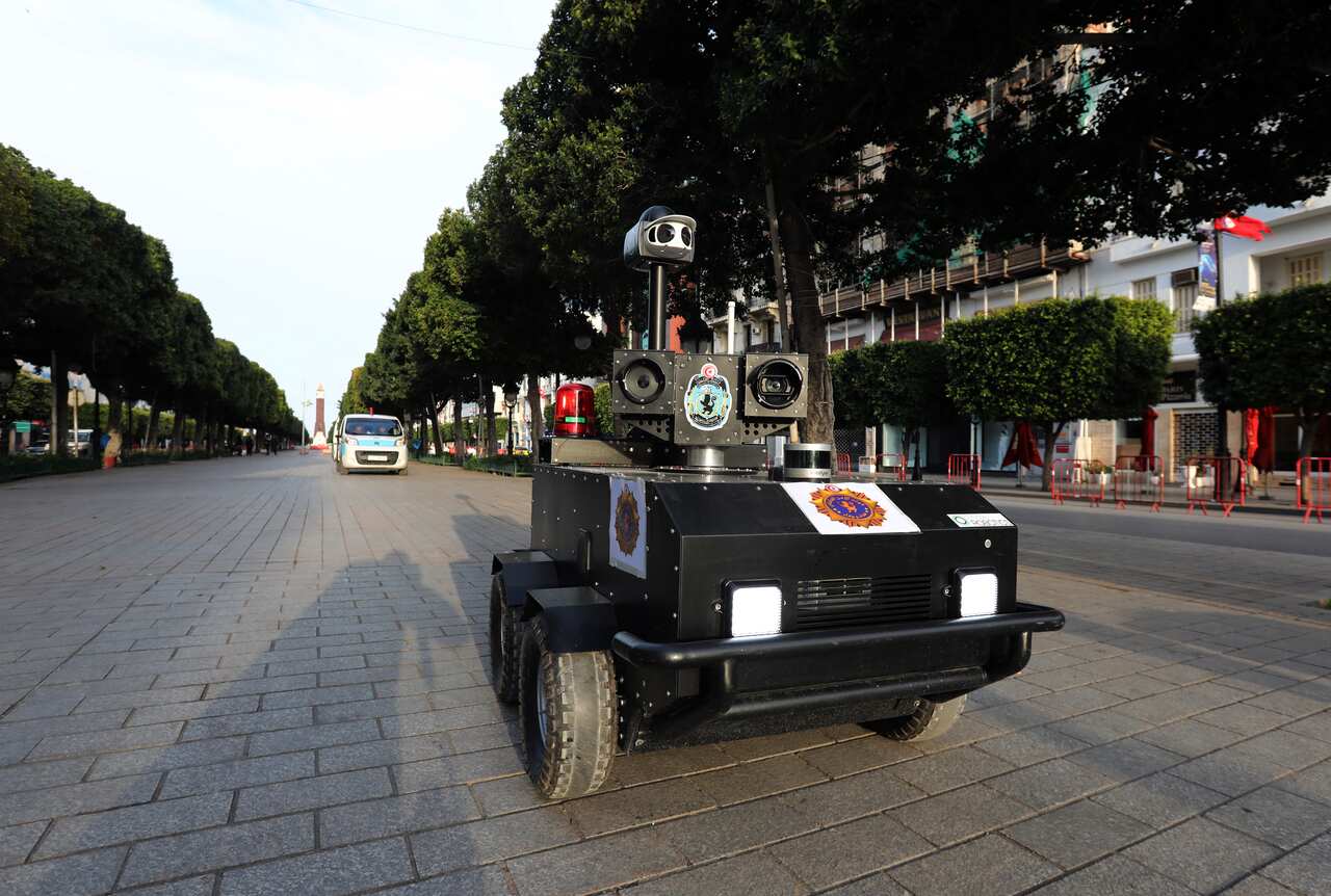 A Tunisian police robot helping to enforce the country's strict curfew.