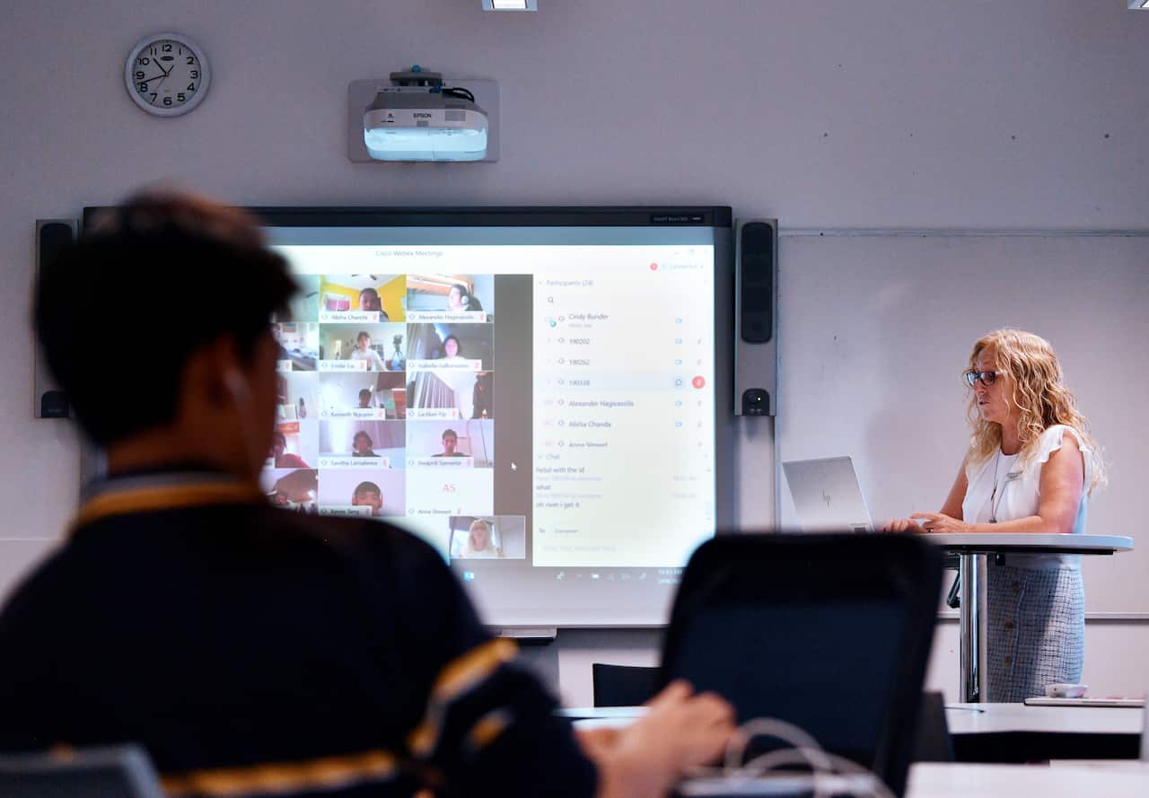 Teacher Cindy Bunder is seen demonstrating a virtual classroom at Glenunga High School in Adelaide