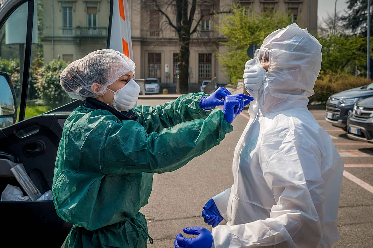 Health workers in Milan are working around the clock.