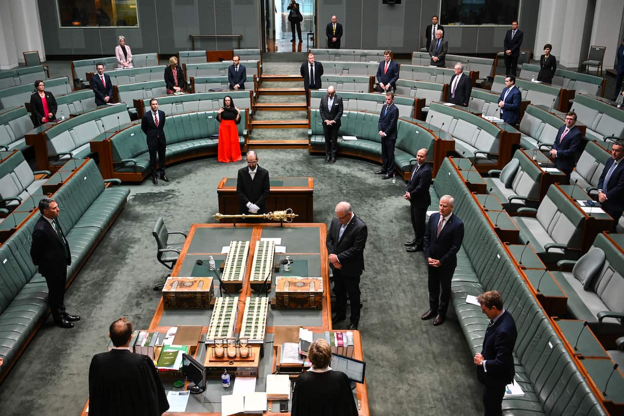 Prime Minister Scott Morrison reacts during a parliamentary sitting under rules of social distancing at Parliament House in Canberra.