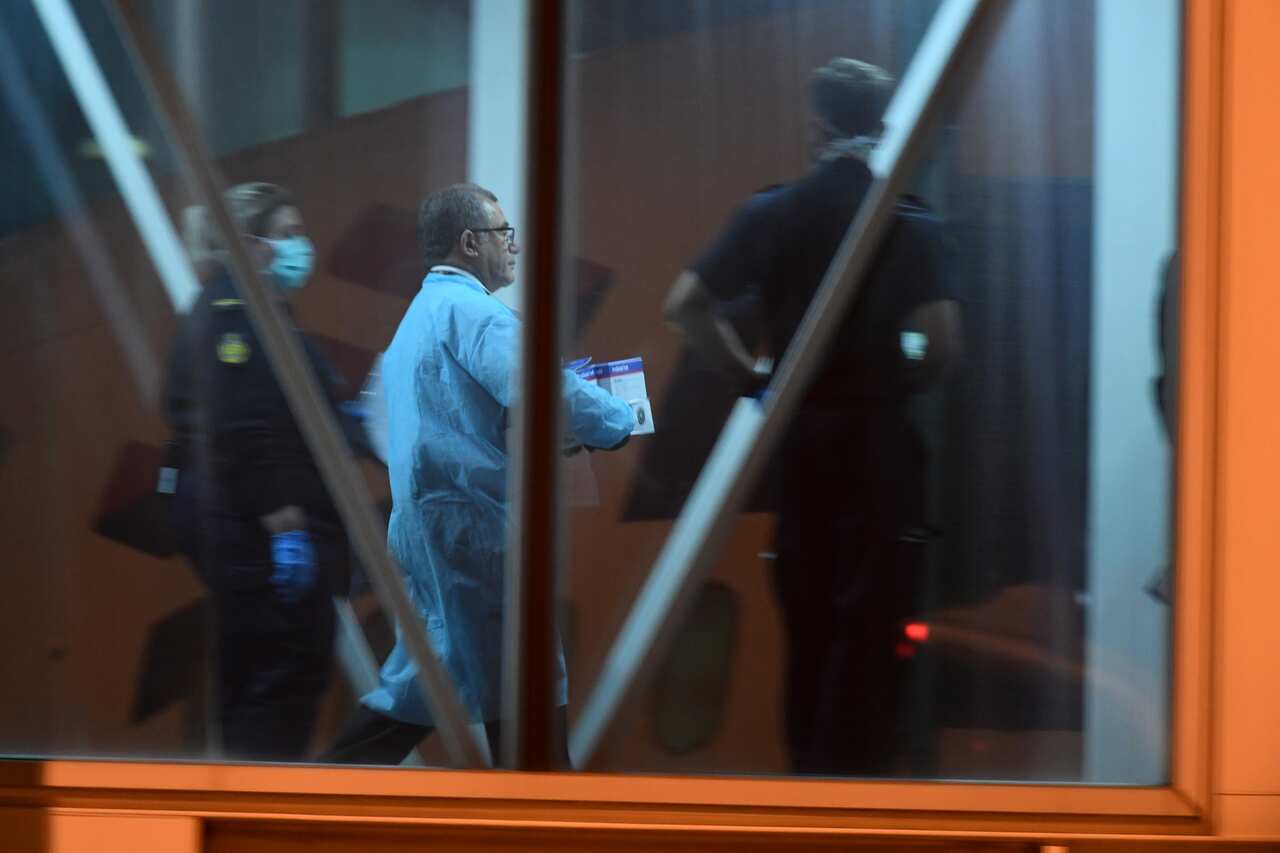 A healthcare worker is seen boarding Latam flight LA1173 after arriving to Melbourne International Airport.