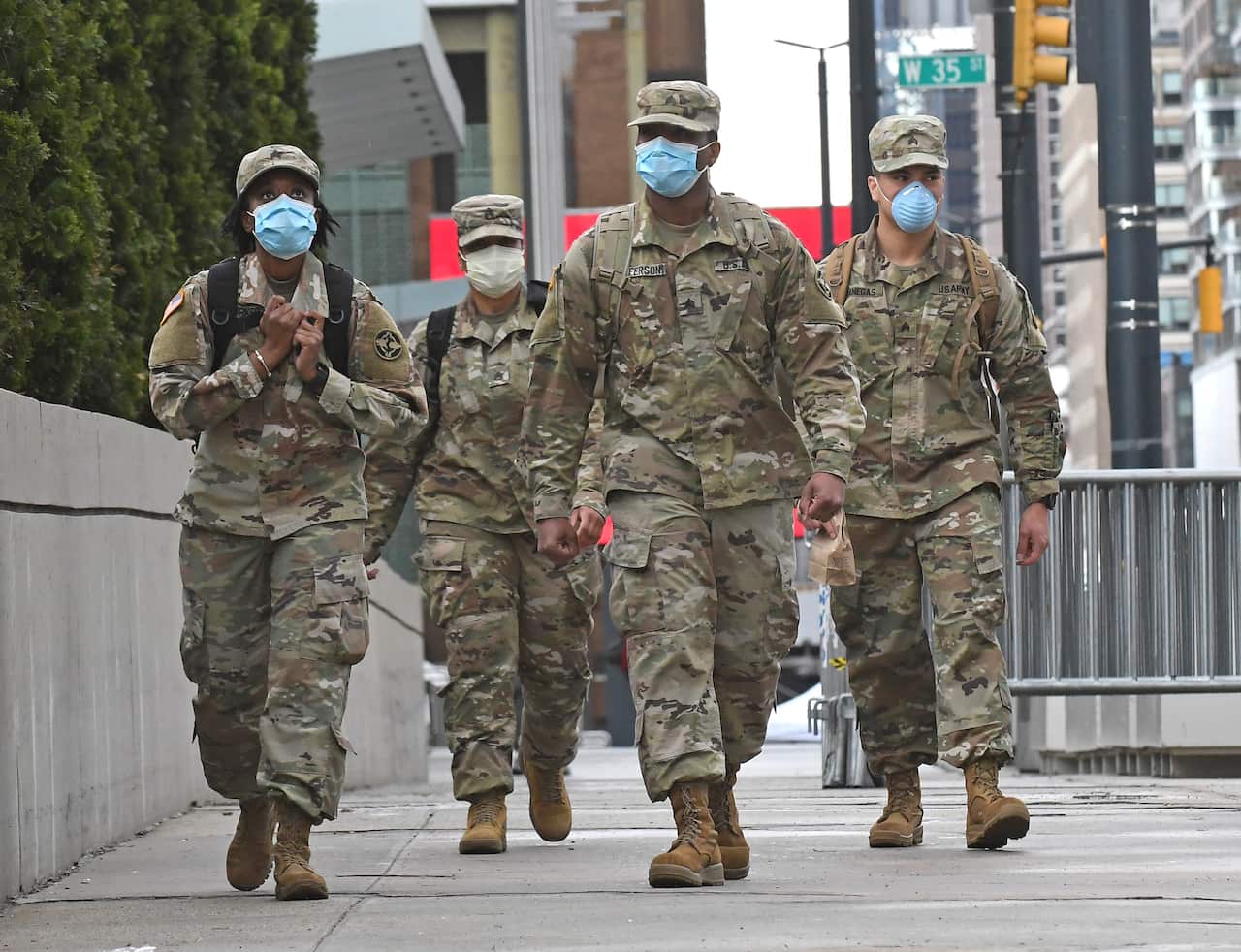US Military personnel are seen on patrol in New York. The US has now overtaken Spain with 15,774 deaths. 
