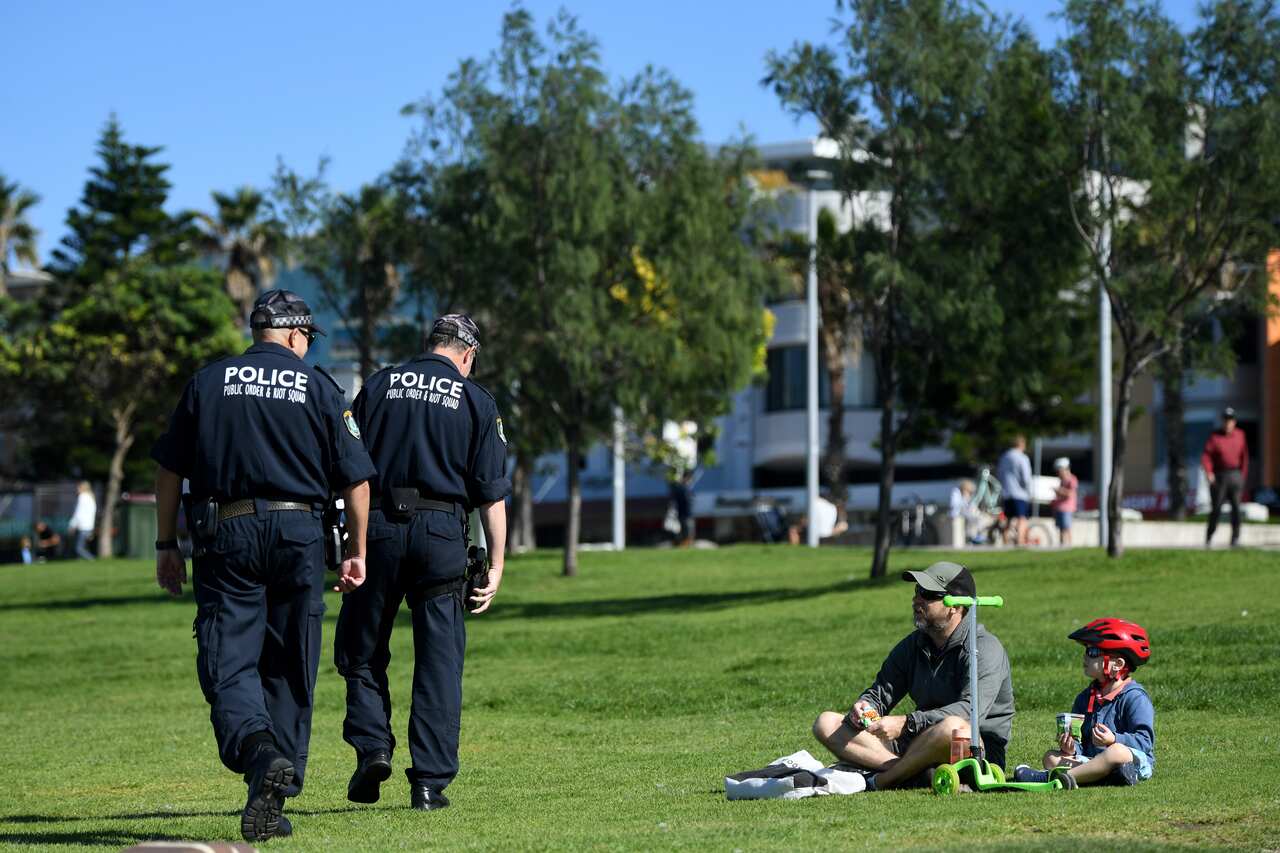 NSW Police ask people to move on while patrolling during the Easter Long Weekend at Bondi Beach.