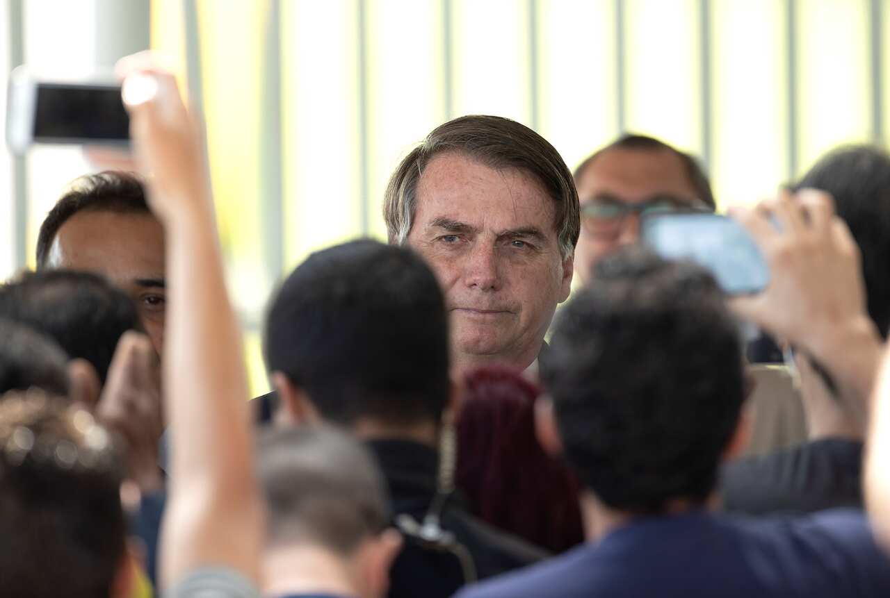 epa08360994 Brazilian President Jair Bolsonaro leaves the Palacio do Alvorada, the seat of the presidency, in Brasilia, Brazil, 13 April 2020. EPA/Joedson Alves