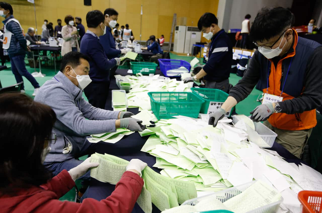 Election officials during vote counting after voting in the general elections was closed in Seoul, South Korea.