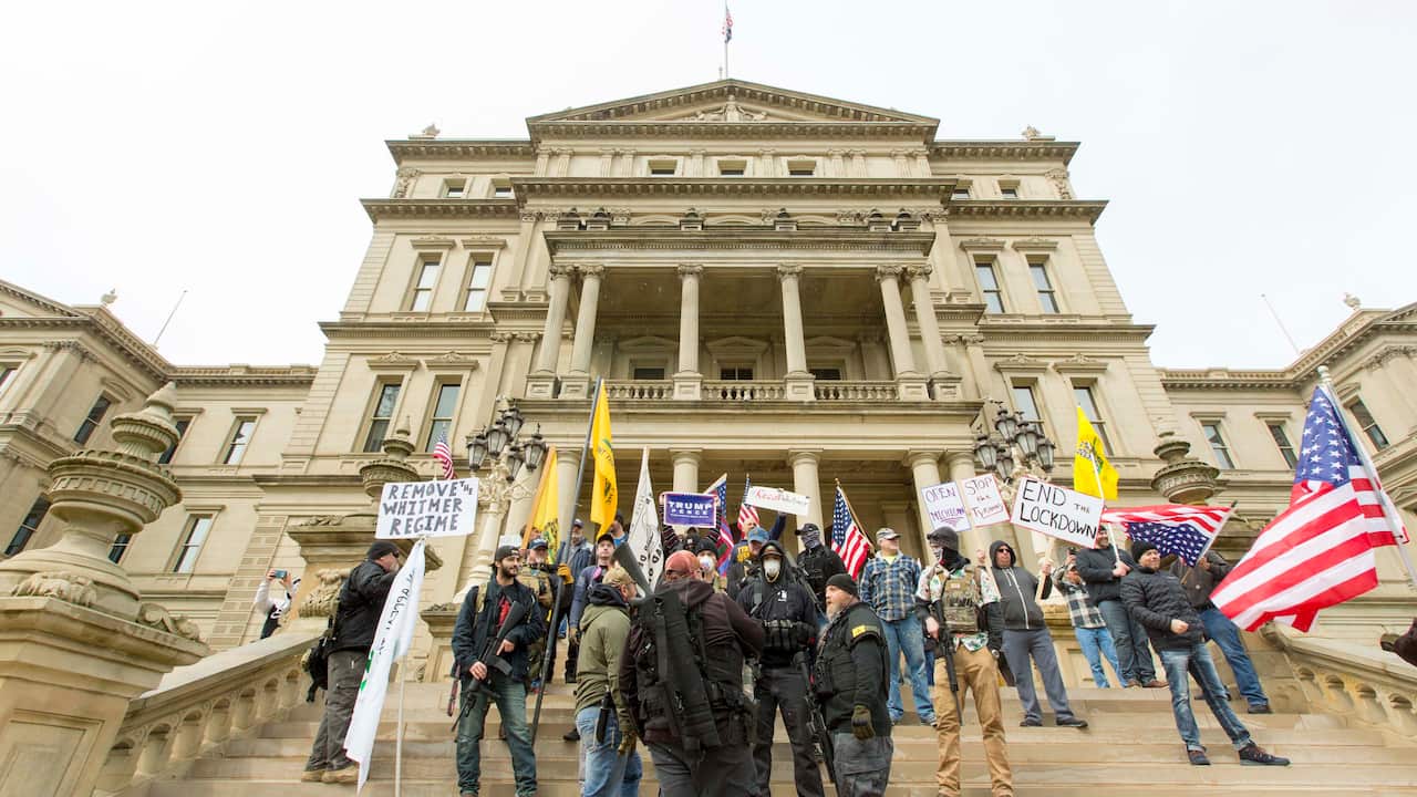 Protesters open-carrying their firearms join in 'Operation Gridlock' in front of the Michigan state Capitol in Lansing, Michigan.