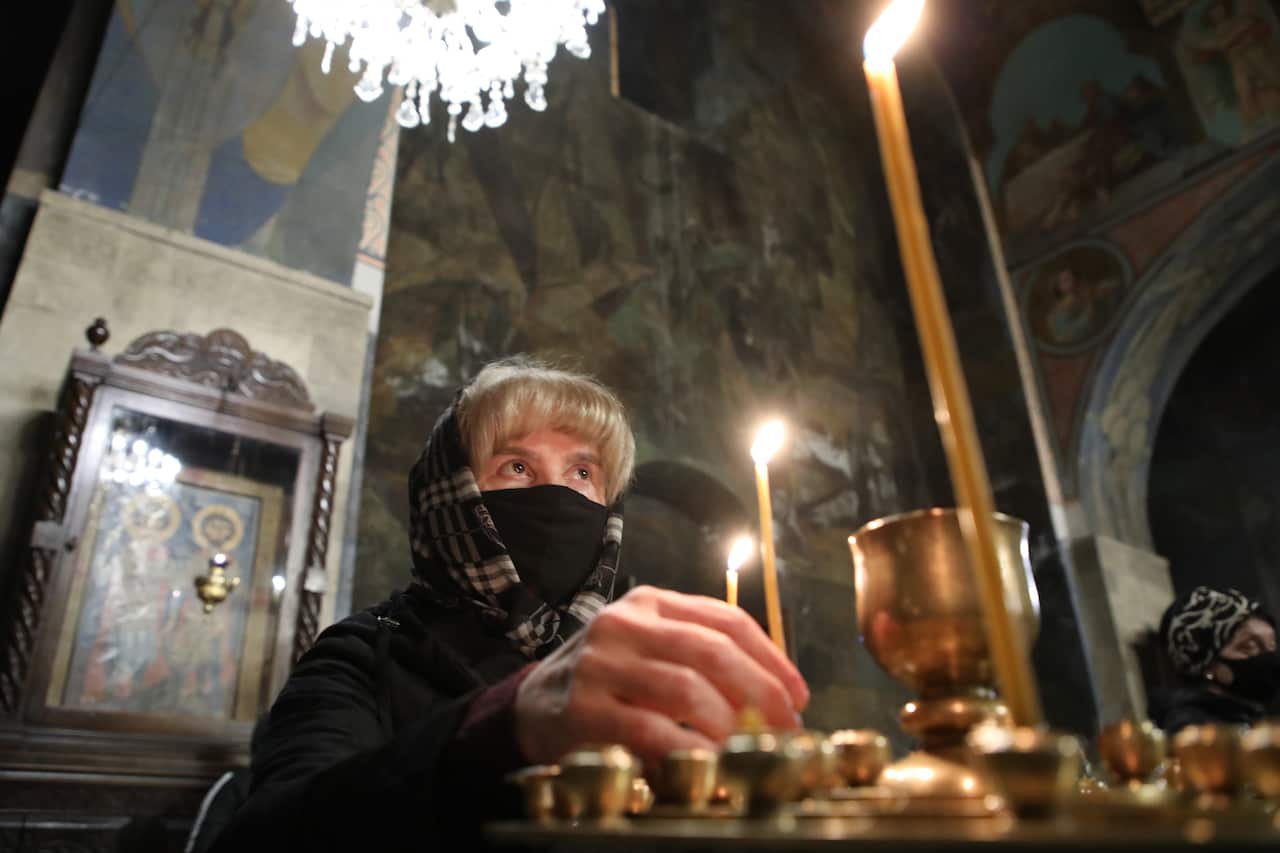 Georgian Orthodox believers attend an Easter service