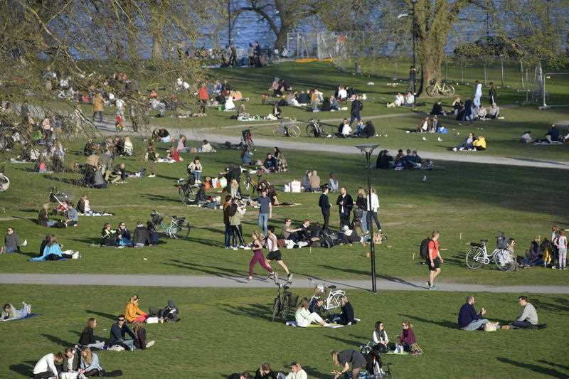 People gather in a park in Stockholm, Sweden, Wednesday April 22, 2020