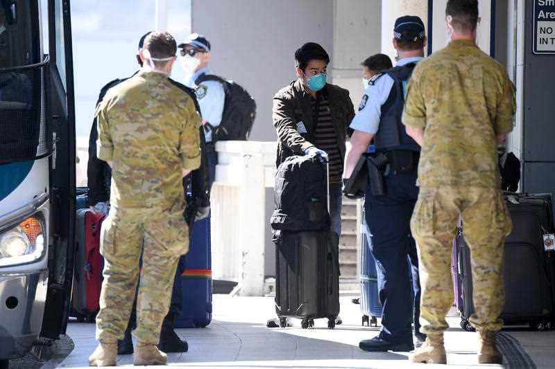 Crew from the Ruby Princess cruise ship are seen arriving at Sydney International Airport in Sydney, Thursday, April 23, 2020
