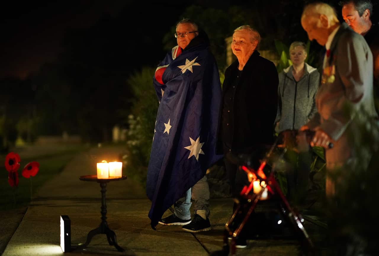 People pay their respects onAnzacDay in Melbourne.