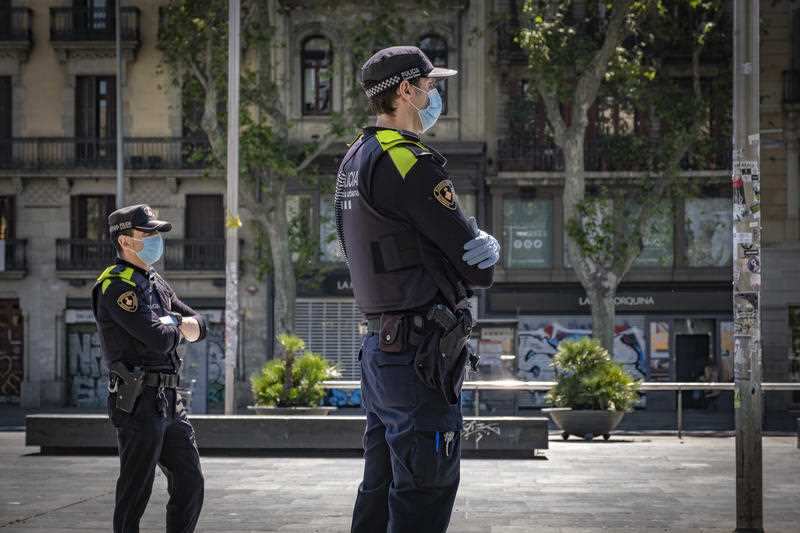 Police officers in Barcelona, Spain wearing face masks amid the coronavirus lockdown