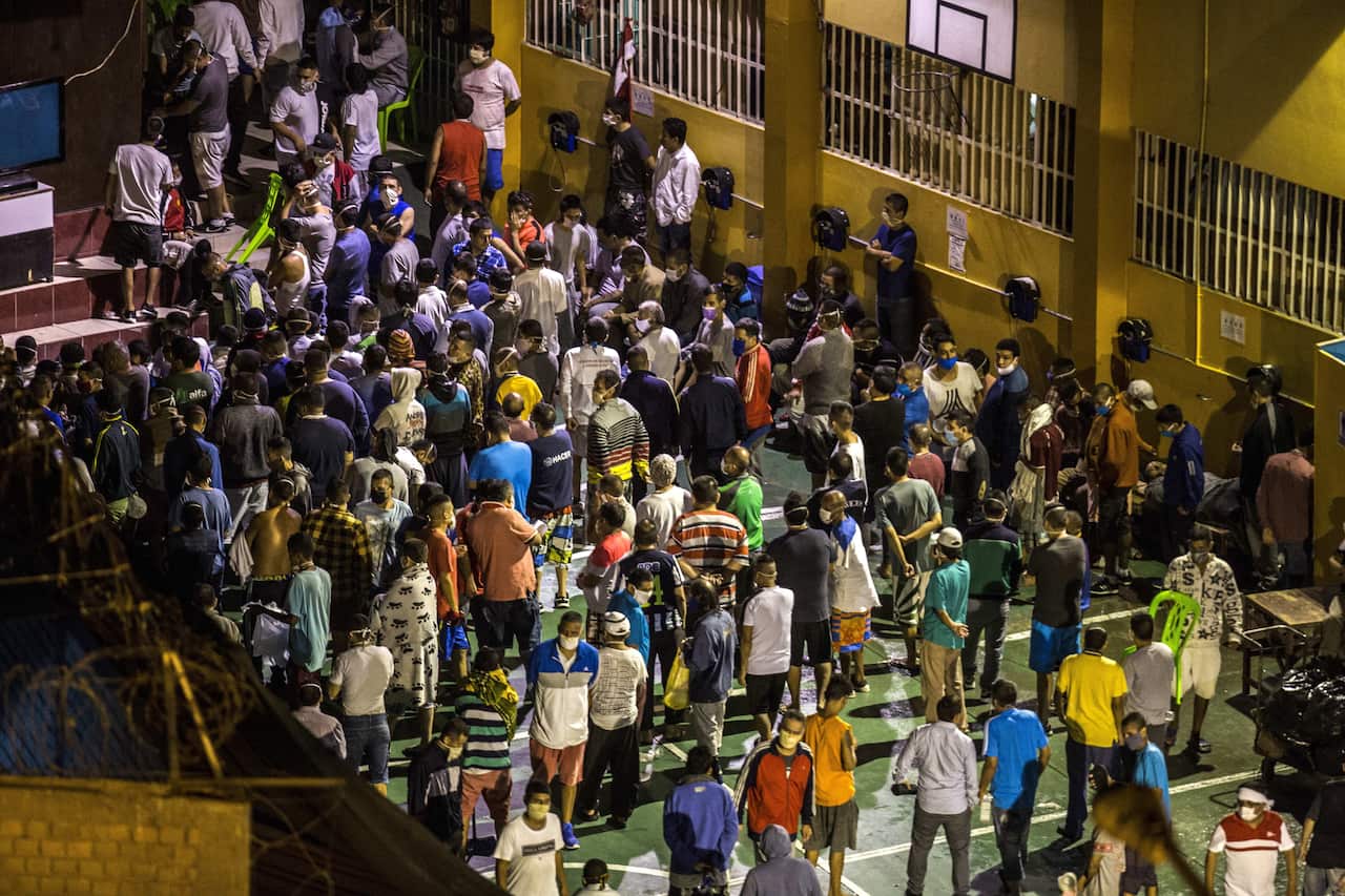 Nine people have died in a Peru prison riot following two coronavirus deaths in custody.