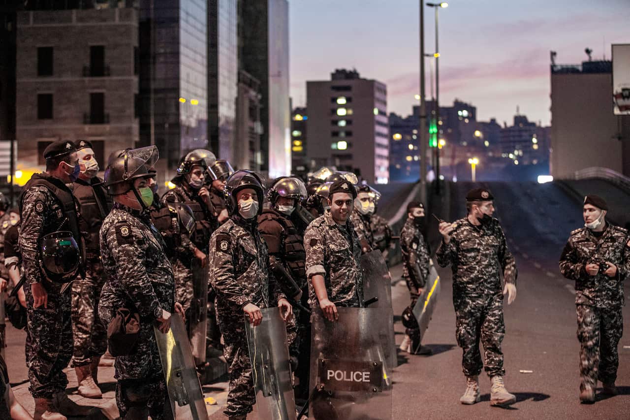 Lebanese riot police stand guard during an anti-government protest this week.