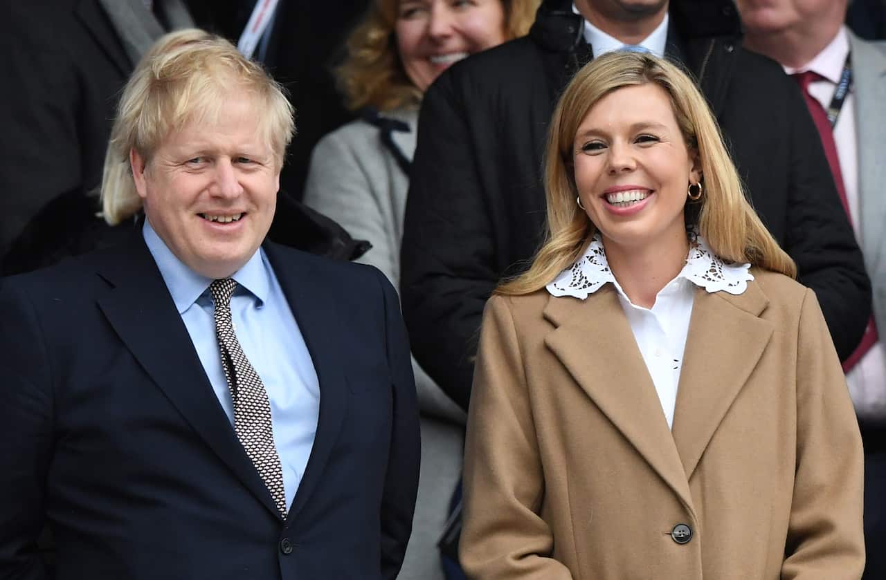 British Prime Minister, Boris Johnson (L) and his partner Carrie Symonds (R) in March.