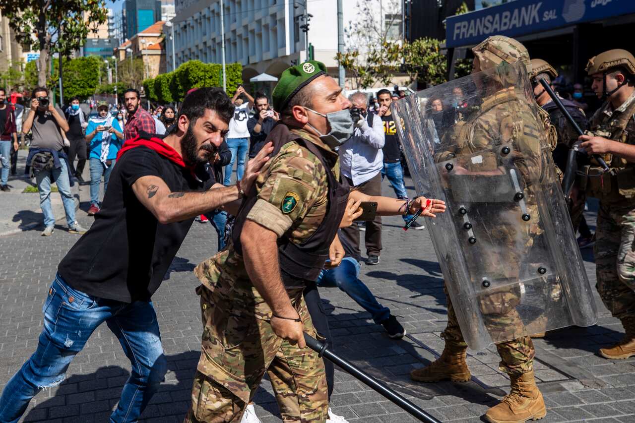 Hundreds rallied outside Lebanon's central bank a day after the Prime Minister said he'll be seeking a rescue program from the International Monetary Fund.