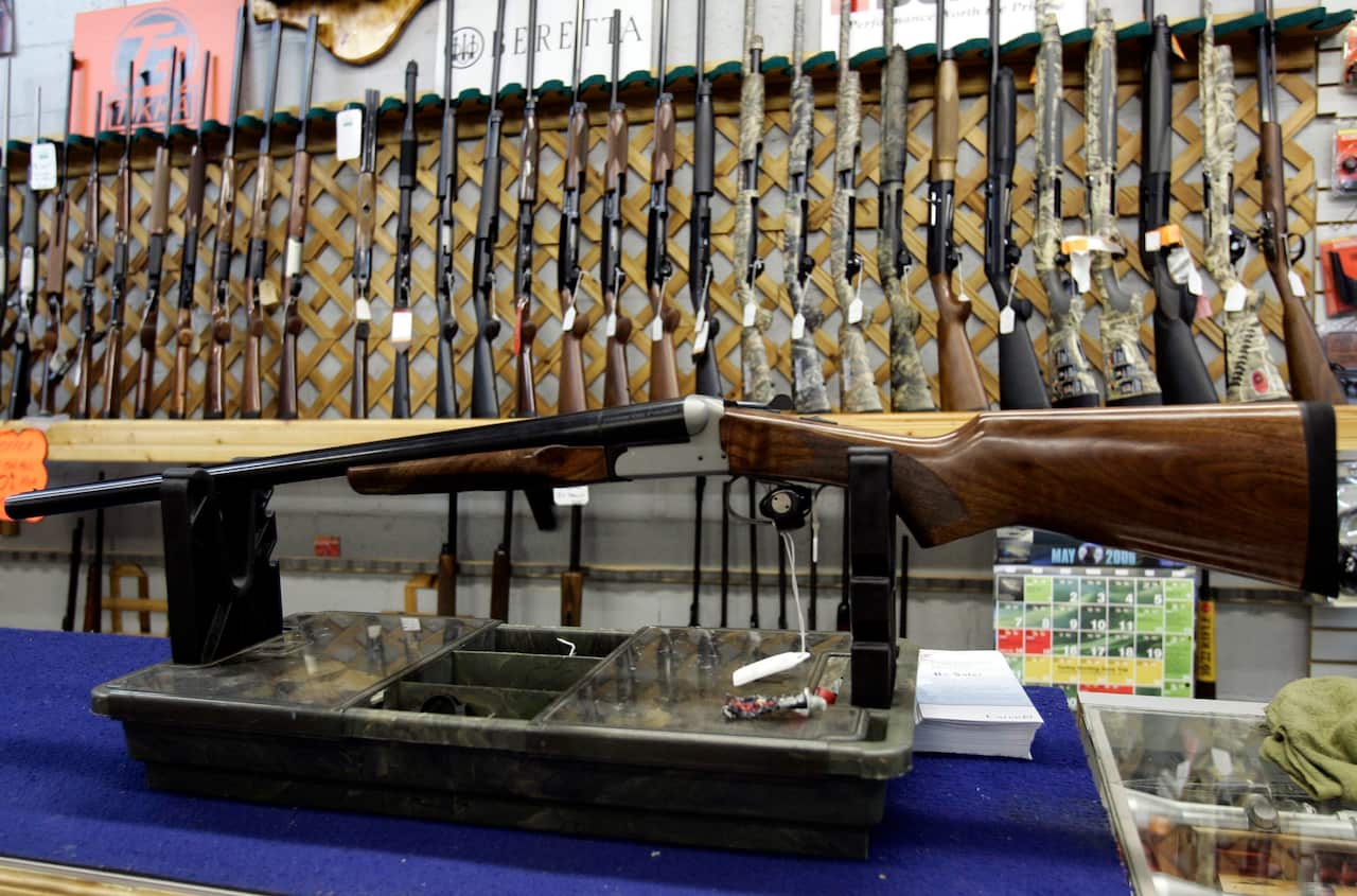 Rifles line a hunting store's shelves in Ottawa, Canada.