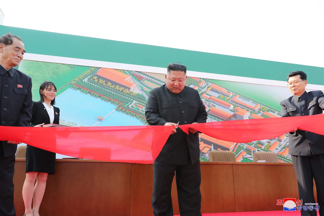 Kim Jong-un cutting a ribbon at what is reportedly his first public appearance in 20 days. 