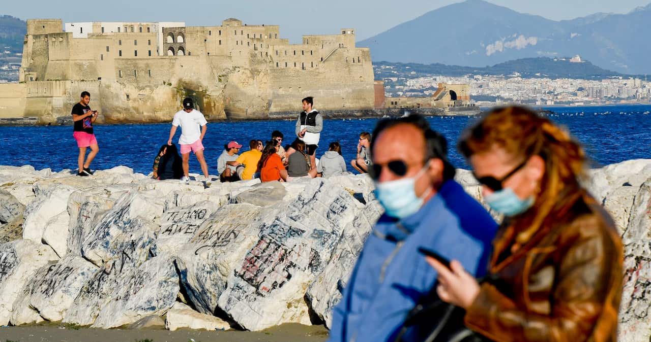 People on the Naples waterfront as Italy relaxes lockdowns.
