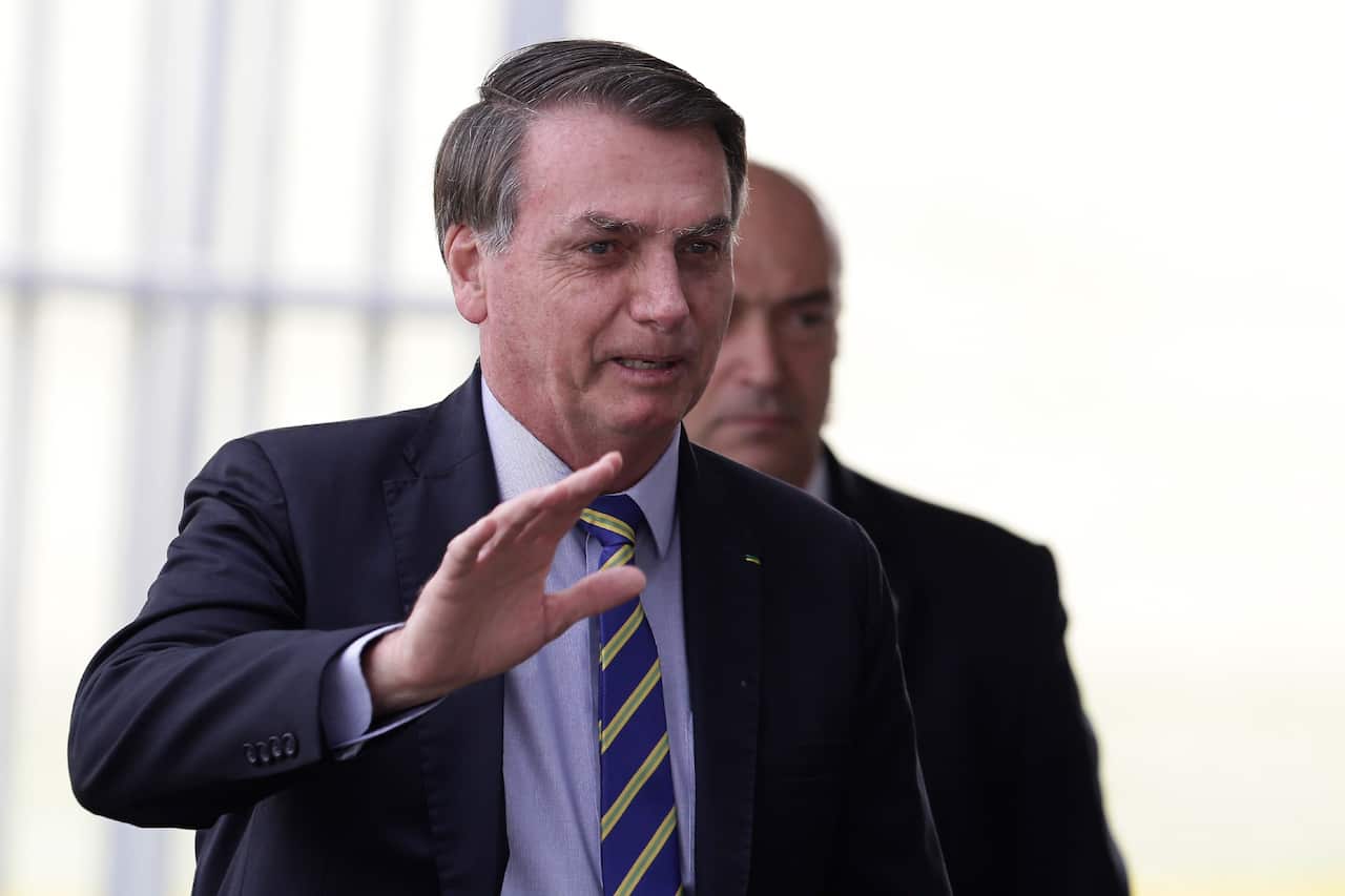 Brazil's President Jair Bolsonaro waves to supporters on Wednesday.