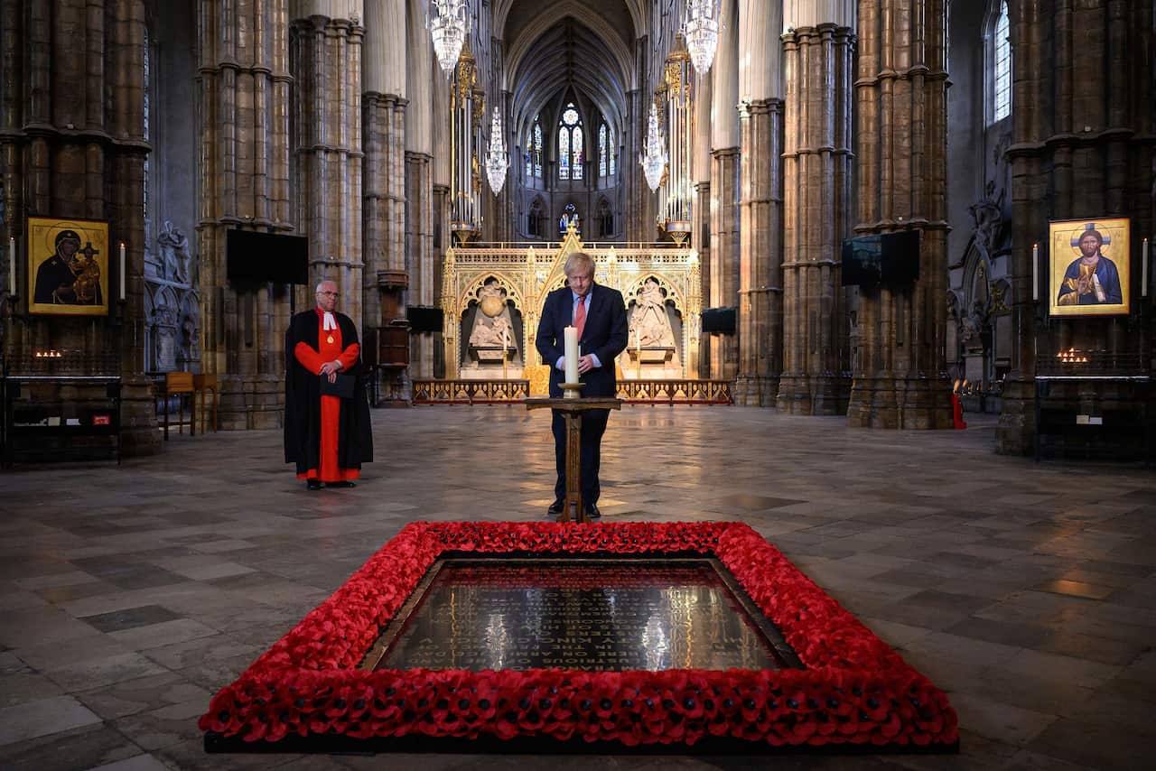 Boris Johnson lights a candle at the Grave of the Unknown Warrior ahead of commemorations to mark the 75th anniversary of VE Day.