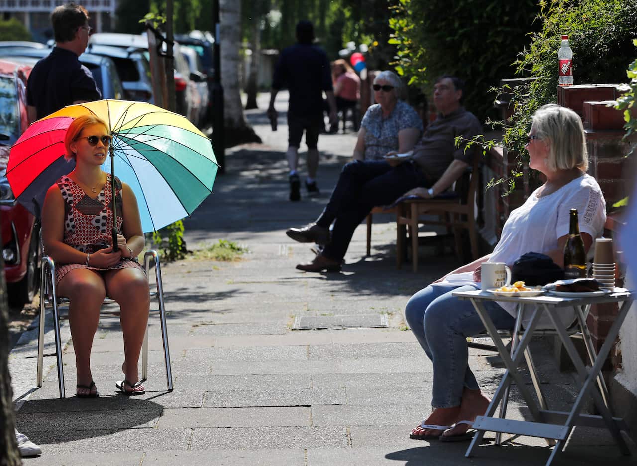 Residents keep social distance in London.