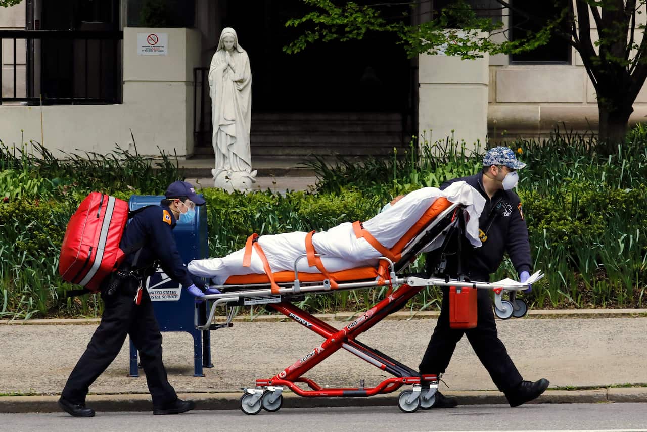 A patient is transported from the Terence Cardinal Cooke health care center on the upper east side in New York.
