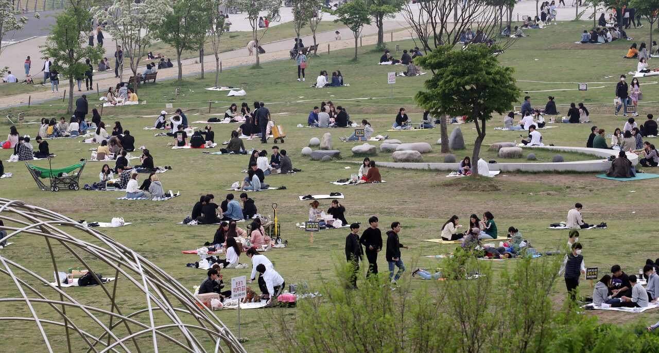 Citizens enjoy picnics at Yeouido Hangang Park in Seoul, South Korea.