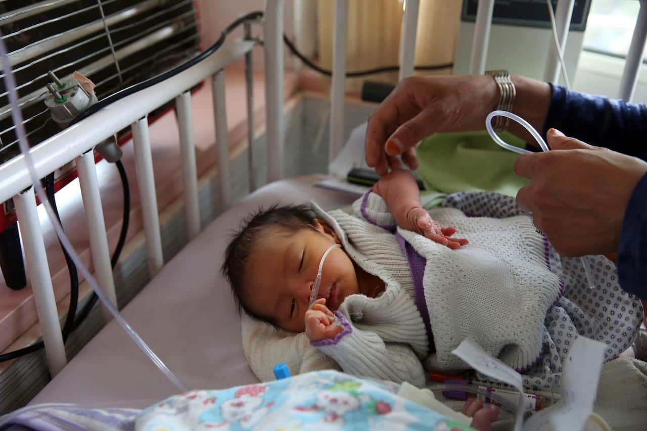 A newborn baby lies in its beds at the Ataturk Children's Hospital.