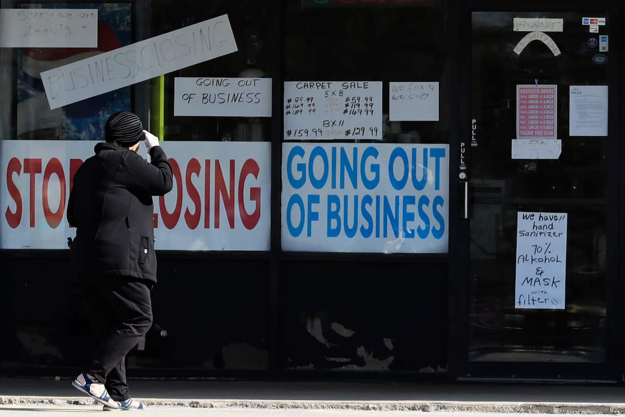 A woman looks at signs at a store in Niles, Illinois.