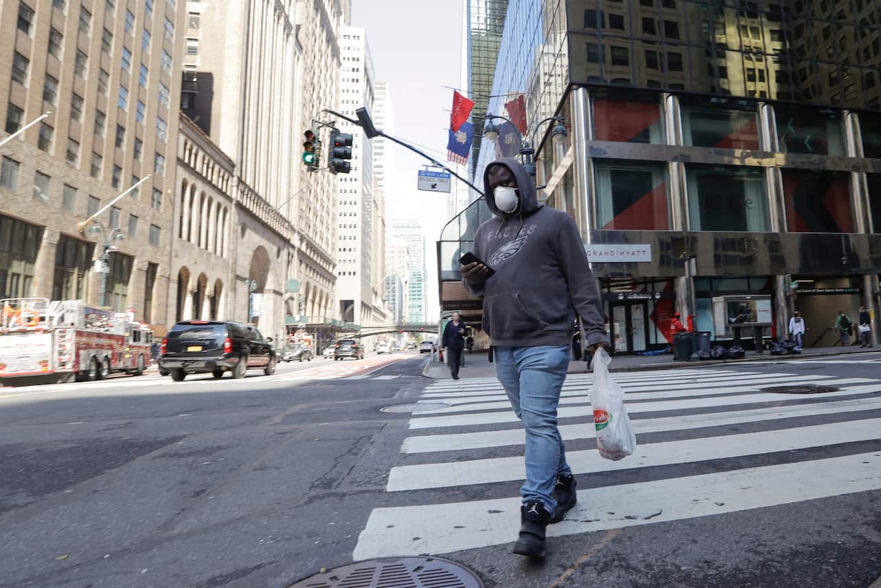 Pedestrians wear protective masks during the coronavirus pandemic in New York.