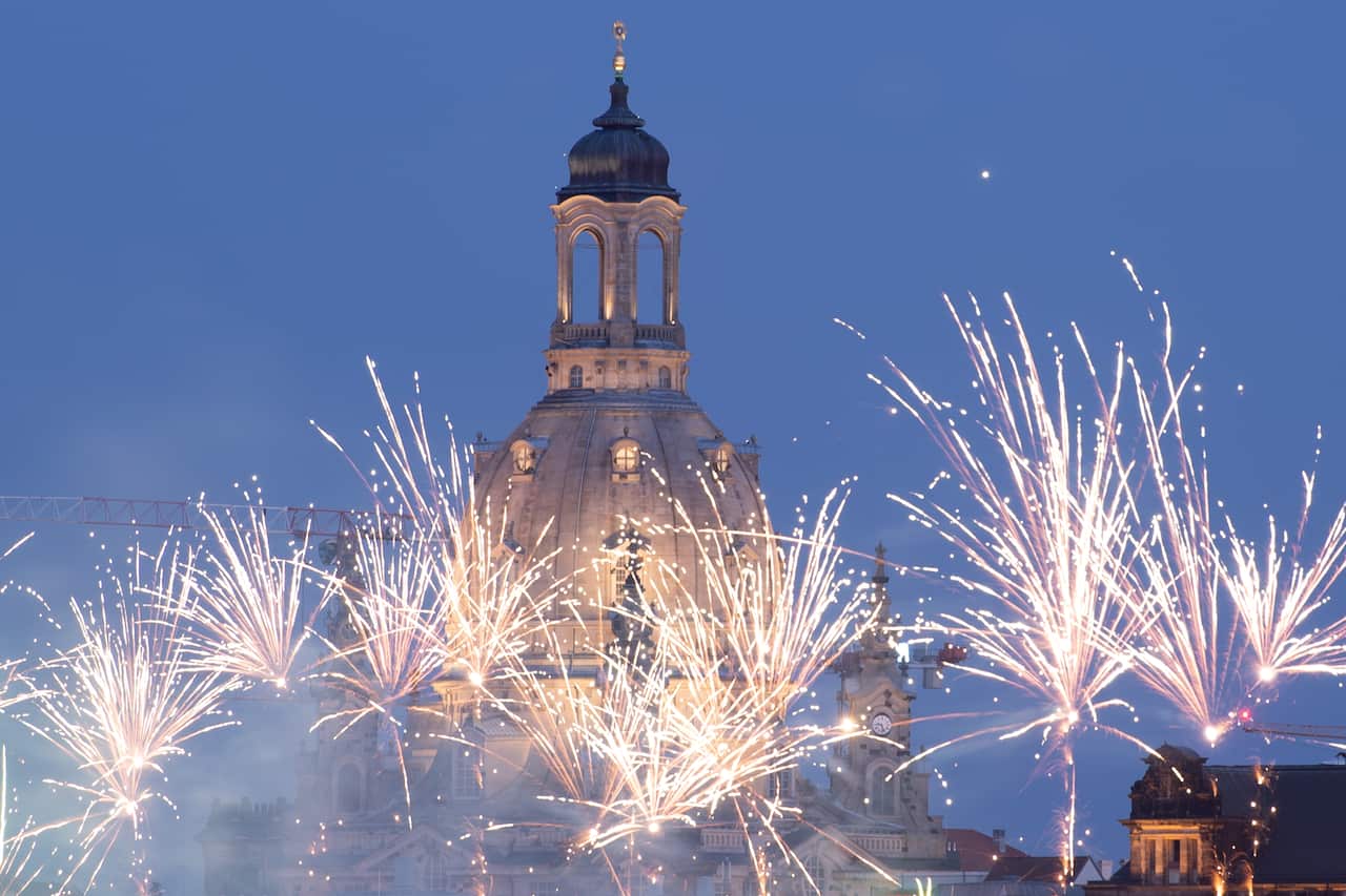 Fireworks go off in front of the Frauenkirche church in Dresden, Germany, as people celebrate the reopening of gastronomy businesses.