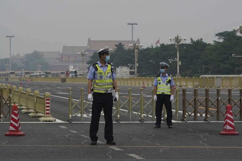 Police block off the road to Tiananmen Square 