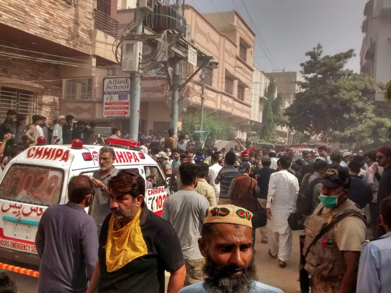 Ambulance arrive near the scene of a passenger plane crash in Karachi, Pakistan, 22 May 2020