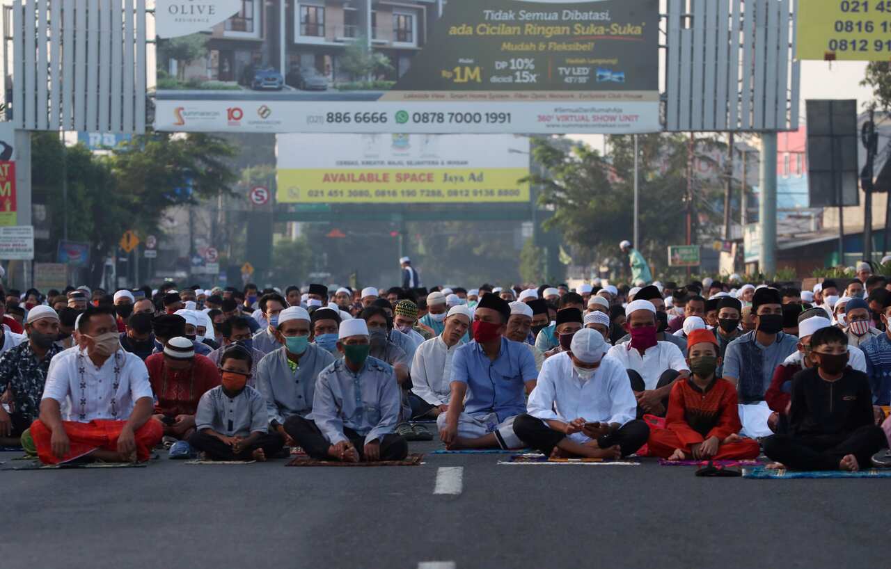 Indonesian Muslim attend Eid al-Fitr prayer that marks the end of the holy fasting month of Ramadan in Bekasi on the outskirts of Jakarta