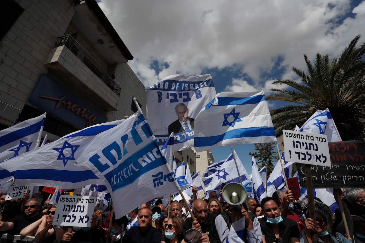 Supporters of Israeli Prime Minister Benjamin Netanyahu protest outside the district court where he is facing a trial for alleged corruption crimes
