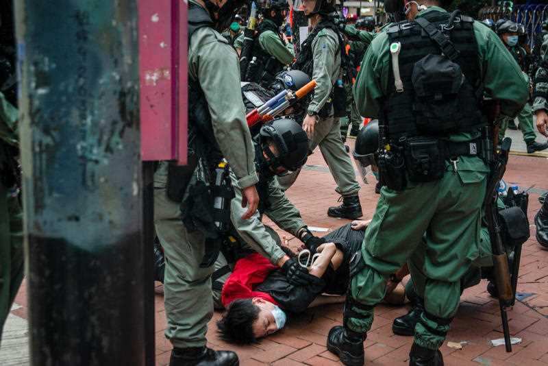 Hong Kong police arrest a protester