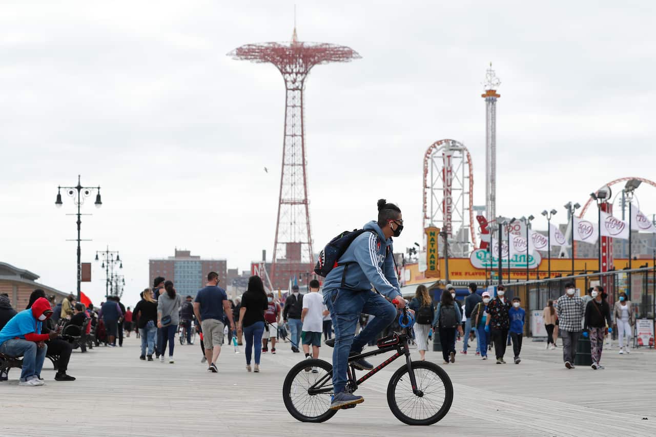 A crowded Coney Island boardwalk in New York on Sunday afternoon.