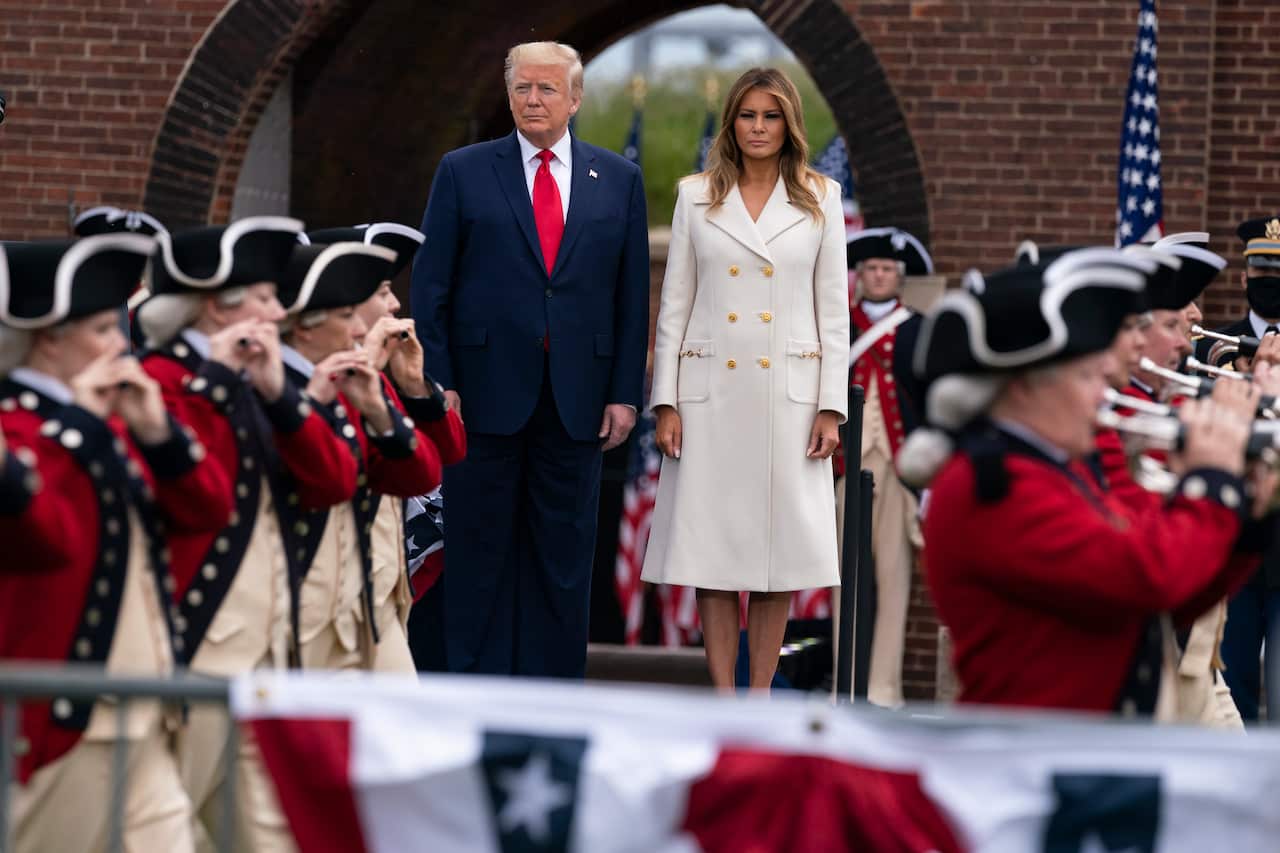 President Donald Trump and first lady Melania Trump participate in a Memorial Day ceremony at Fort McHenry National Monument and Historic Shrine, Monday, May 25, 2020, in Baltimore. (AP Photo/Evan Vucci)