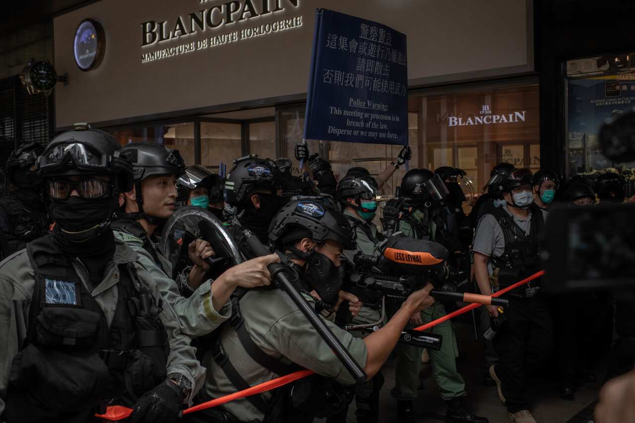 Riot police agents fire pepper bullets at protesters during Wednesday's demonstration in Hong Kong.