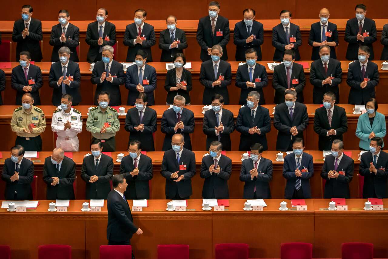 Delegates applaud as Chinese President Xi Jinping arrives for the closing session of Chinas National Peoples Congress (NPC) in Beijing on Thursday.