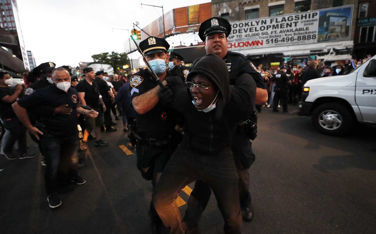 The New York Police department budget will be cut by $1.45 billion