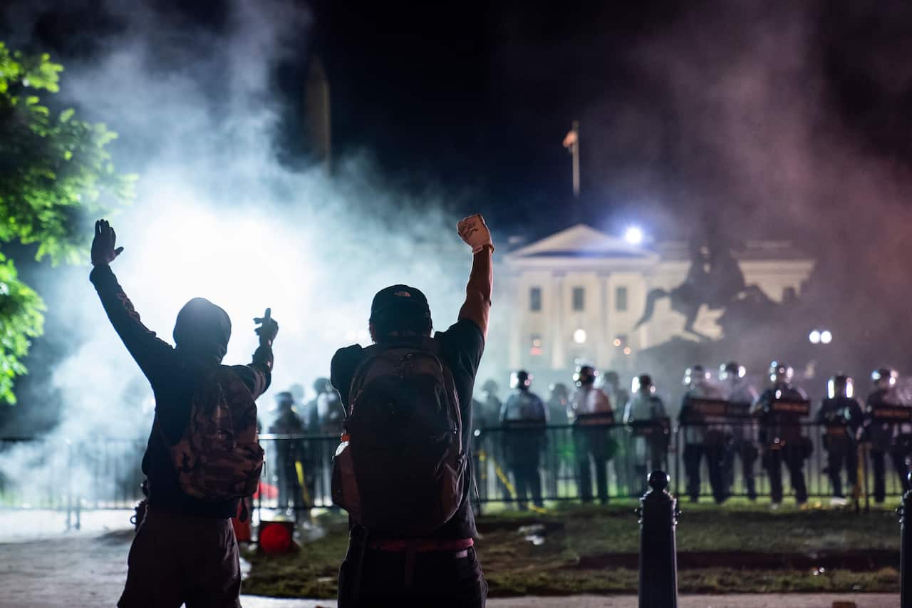 Protesters confront police outside the White House