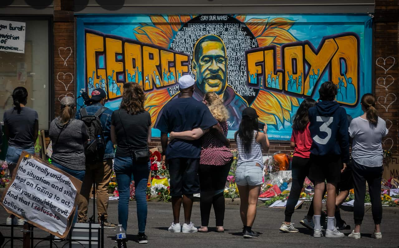 Supporters visit a memorial to George Floyd in Minneapolis, established on the spot where the 46-year-old lost his life.