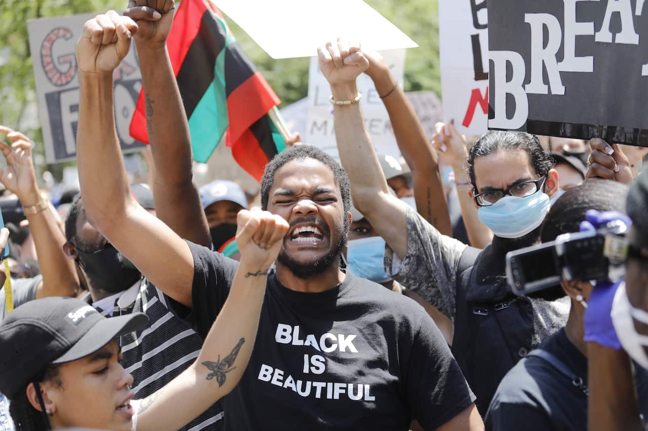 Protesters during a George Floyd Memorial demonstration at Cadman Plaza in Brooklyn , New York.